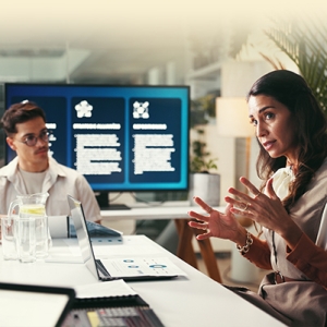 People sitting together at a conference table discussing strategy