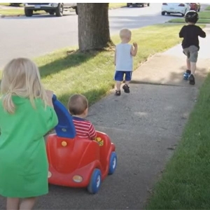 four children running outside