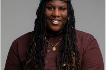 Black female smiling at the camera