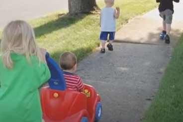 four children running outside